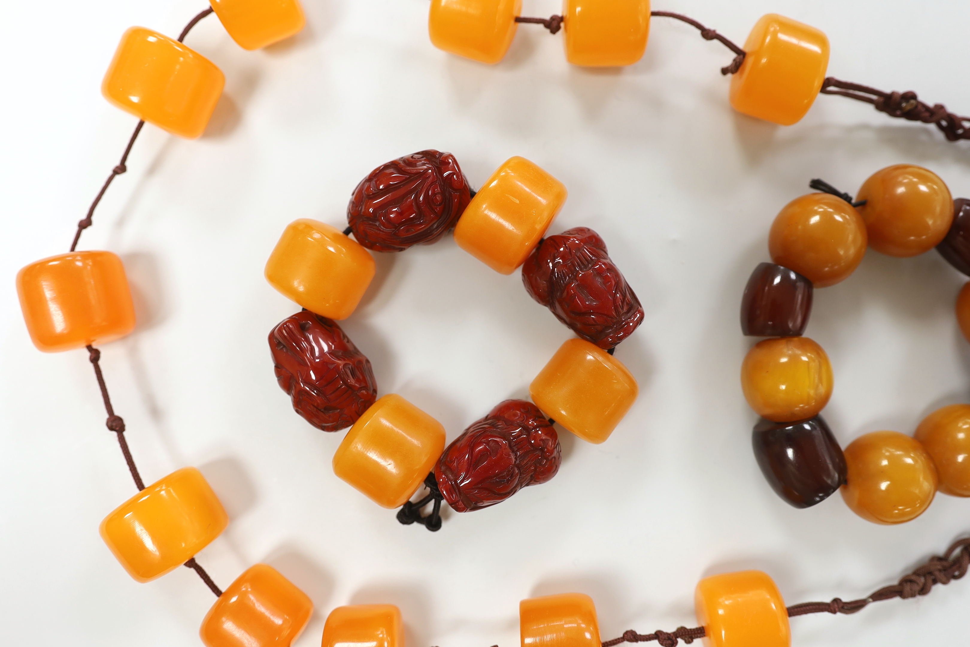 Three assorted amber items